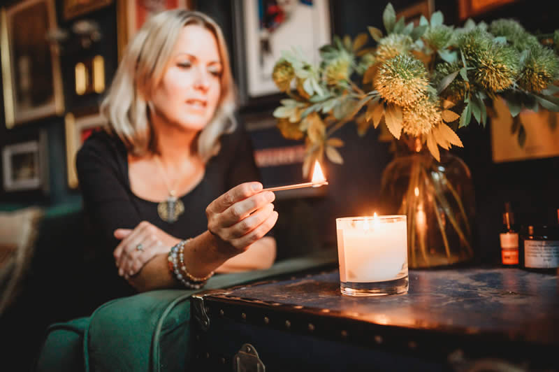 Heather lighting  candle